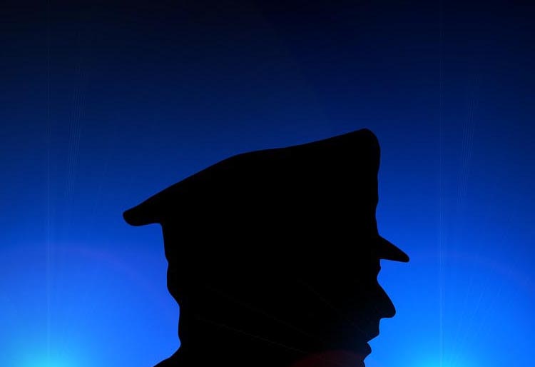 A man's head with a hat side view silhouette